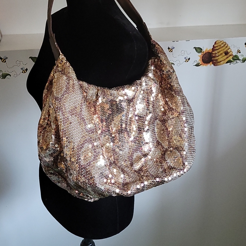 Animal print sequined hobo shoulder bag.